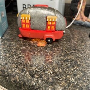 Red and Silver Toy Caravan